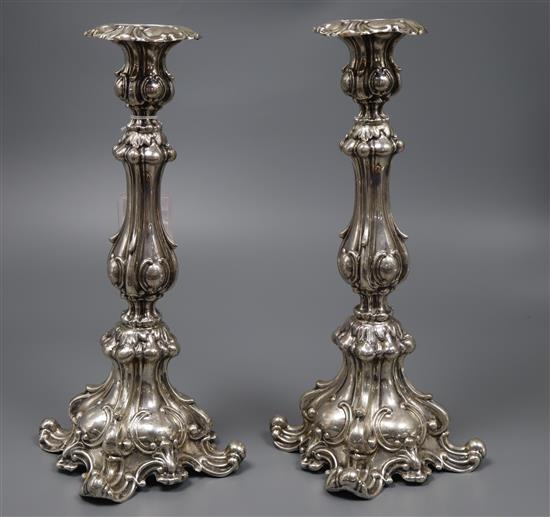 A pair of early 20th century Austro Hungarian 800 standard white metal candlesticks, maker WD, height 30.3cm, 15oz.